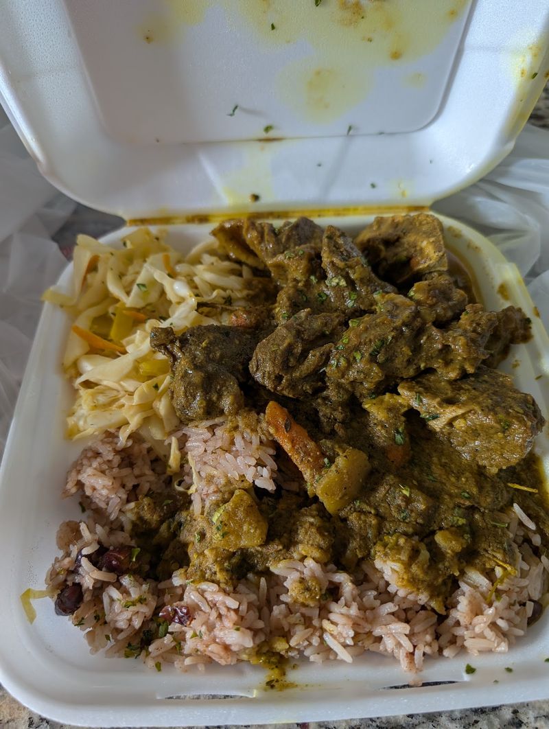 Curry goat over rice