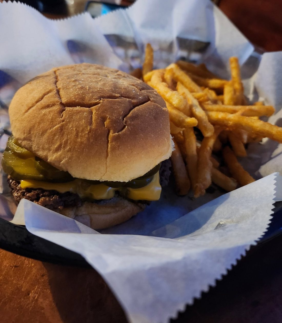 Cheeseburger with a basket of fries